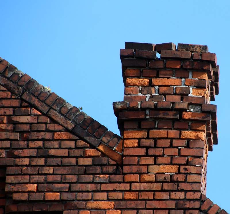 Signs Your Haverhill Home Needs a Chimney Inspection Damaged chimney on an Haverhill home showing cracks and missing mortar